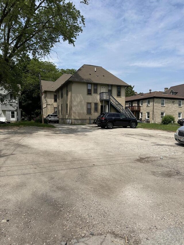 525 Dunbar Ave, Waukesha, WI 53186 - view of front of home with uncovered parking and stairway