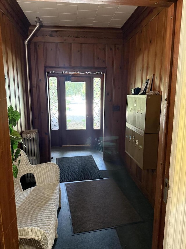 525 Dunbar Ave, Waukesha, WI 53186 - entrance foyer featuring radiator heating unit and wood walls