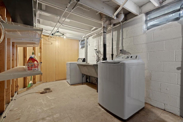 3021 Dwight St, Racine, WI 53403 - unfinished basement featuring separate washer and dryer and concrete block wall