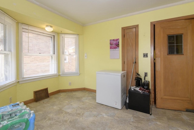 3940 N 64th St, Milwaukee, WI 53216 - laundry room featuring crown molding and baseboards