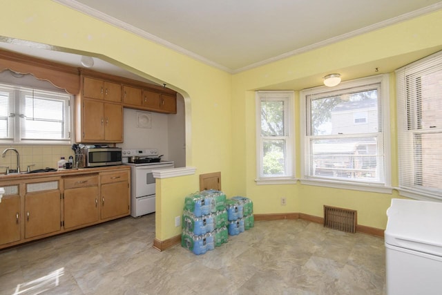 3940 N 64th St, Milwaukee, WI 53216 - kitchen with electric range, stainless steel microwave, ornamental molding, brown cabinetry, and light floors