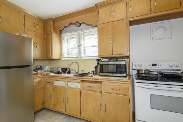 3940 N 64th St, Milwaukee, WI 53216 - kitchen with appliances with stainless steel finishes, backsplash, and ornamental molding