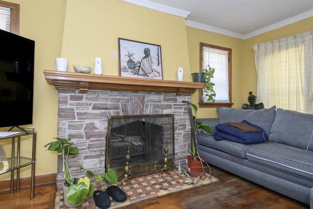 3940 N 64th St, Milwaukee, WI 53216 - living room featuring wood finished floors, crown molding, and a stone fireplace