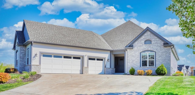 W195N5814 Deer Park Ct, Menomonee Falls, WI 53051 - view of front facade featuring a garage, concrete driveway, brick siding, and a shingled roof