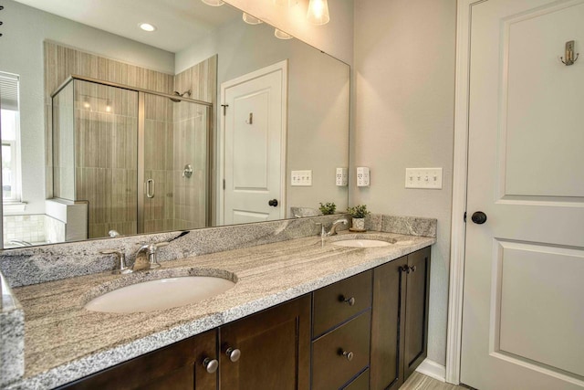 W195N5814 Deer Park Ct, Menomonee Falls, WI 53051 - full bath with double vanity, a stall shower, and recessed lighting