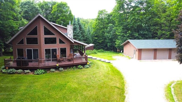 N6448 Neva Lake Rd, Deerbrook, WI 54424 - rear view of house with a wooden deck, a detached garage, a lawn, a chimney, and a view of trees