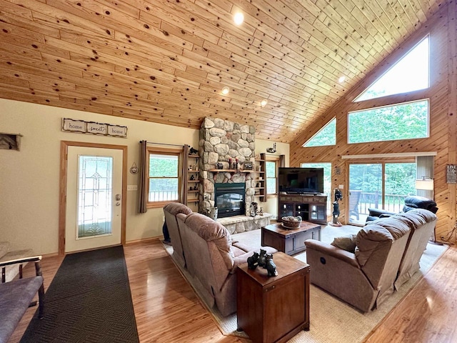 N6448 Neva Lake Rd, Deerbrook, WI 54424 - living area with high vaulted ceiling, a fireplace, and light wood finished floors
