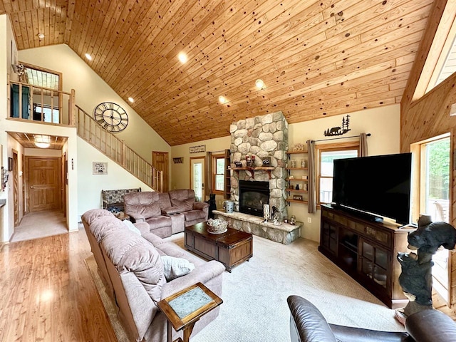 N6448 Neva Lake Rd, Deerbrook, WI 54424 - living room featuring stairway, high vaulted ceiling, a stone fireplace, wooden ceiling, and recessed lighting