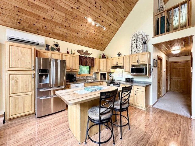 N6448 Neva Lake Rd, Deerbrook, WI 54424 - kitchen with stainless steel appliances, a wall mounted AC, light brown cabinetry, under cabinet range hood, and high vaulted ceiling