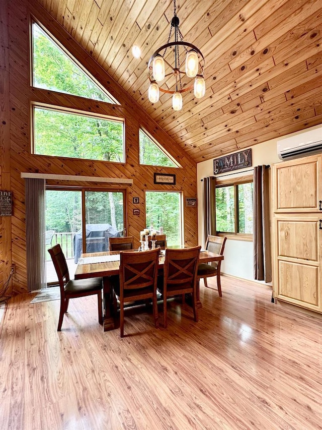 N6448 Neva Lake Rd, Deerbrook, WI 54424 - dining area featuring a wall mounted air conditioner, wooden ceiling, a chandelier, high vaulted ceiling, and light wood-style flooring