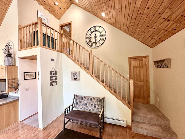 N6448 Neva Lake Rd, Deerbrook, WI 54424 - stairway with baseboard heating, wooden ceiling, wood finished floors, high vaulted ceiling, and recessed lighting