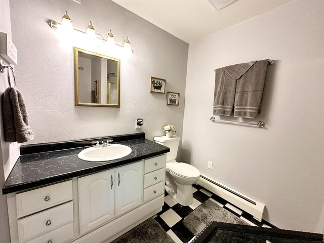 N6448 Neva Lake Rd, Deerbrook, WI 54424 - bathroom featuring a baseboard radiator, vanity, and tile patterned floors