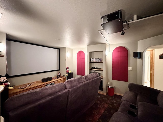 N6448 Neva Lake Rd, Deerbrook, WI 54424 - carpeted cinema featuring arched walkways and baseboards