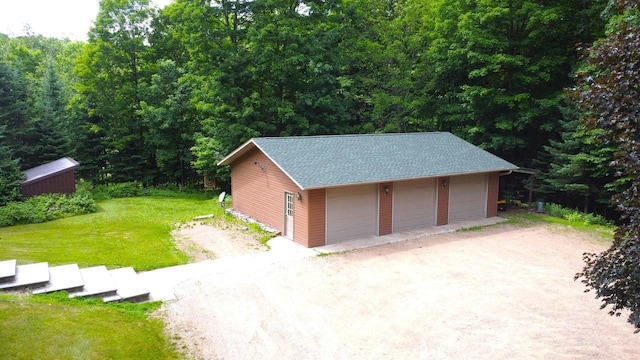 N6448 Neva Lake Rd, Deerbrook, WI 54424 - detached garage featuring a wooded view