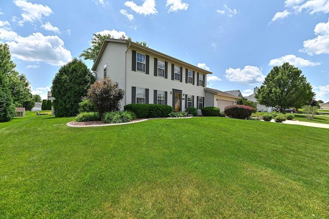 2191 W Hope Ln, Oak Creek, WI 53154 - colonial-style house featuring a garage and a front yard