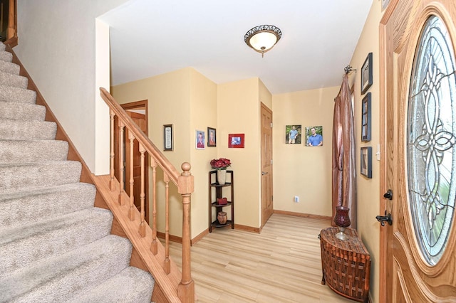 2191 W Hope Ln, Oak Creek, WI 53154 - entrance foyer featuring light wood-type flooring and stairway