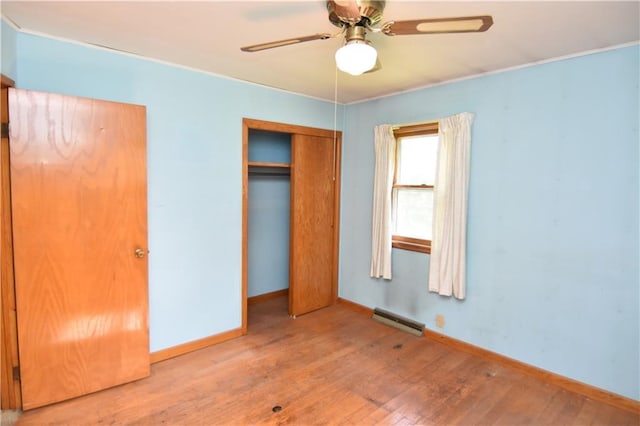 15754 County Highway M, New Auburn, WI 54757 - unfurnished bedroom with wood-type flooring, a closet, and ceiling fan
