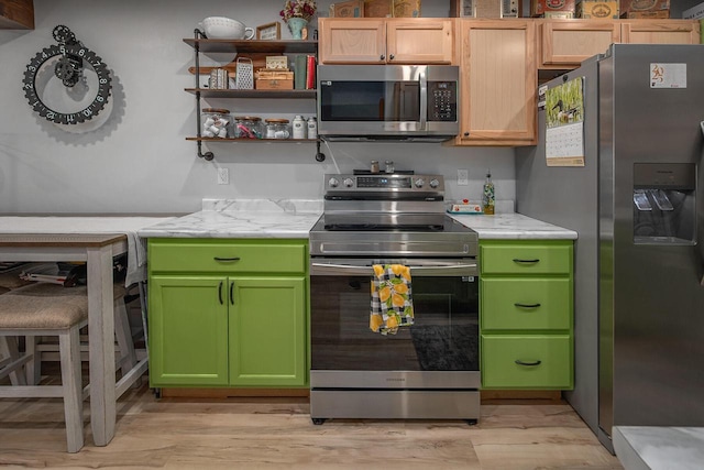 1363 Josephine St Unit E, Waukesha, WI 53186 - kitchen featuring stainless steel appliances, light wood-type flooring, and green cabinetry