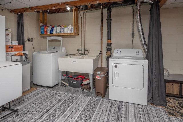 1363 Josephine St Unit E, Waukesha, WI 53186 - laundry room with washing machine and clothes dryer and concrete block wall