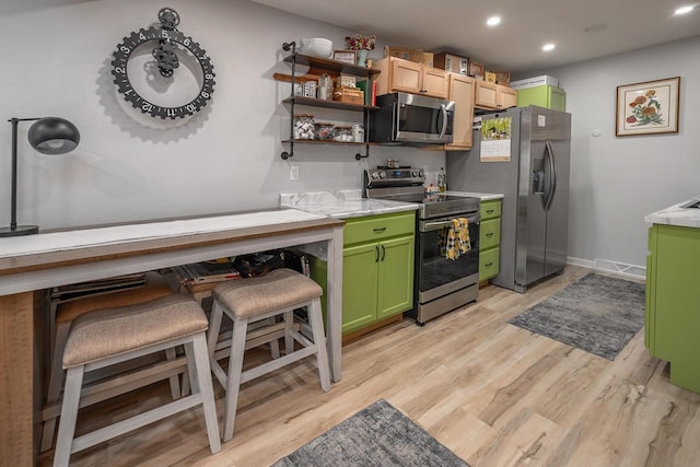 1363 Josephine St Unit E, Waukesha, WI 53186 - kitchen with stainless steel appliances, green cabinetry, light countertops, light wood-style floors, and recessed lighting