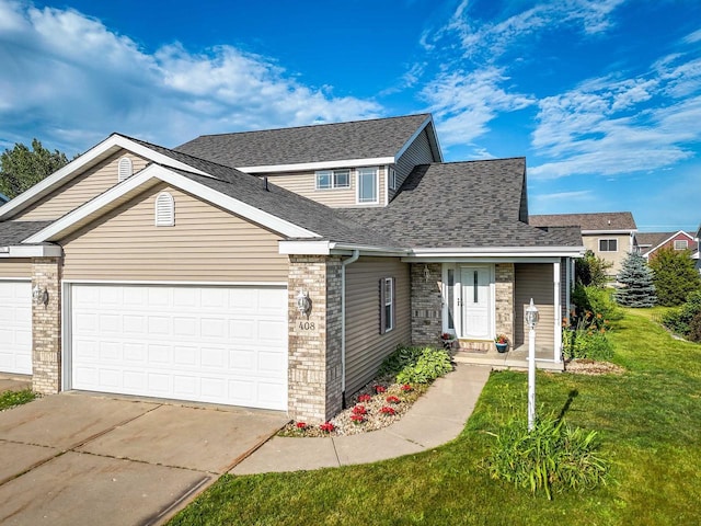 408 Juniper St, Brooklyn, WI 53521 - traditional home featuring brick siding, concrete driveway, an attached garage, and a front lawn