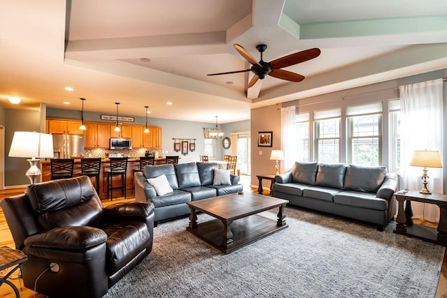 1255 Winterberry Rd, Oconomowoc, WI 53066 - living room with a ceiling fan, recessed lighting, a chandelier, and a tray ceiling