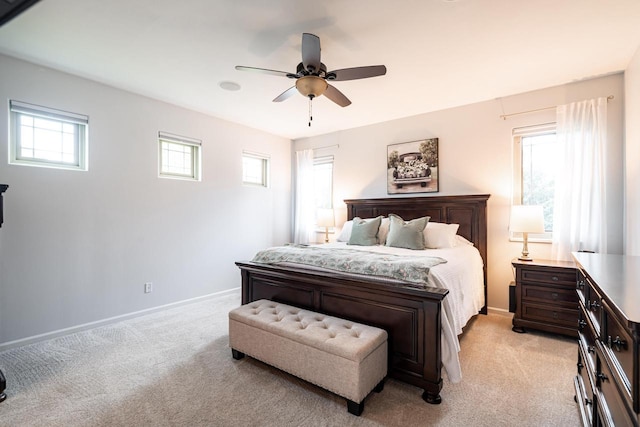 1255 Winterberry Rd, Oconomowoc, WI 53066 - bedroom with light carpet, multiple windows, and ceiling fan