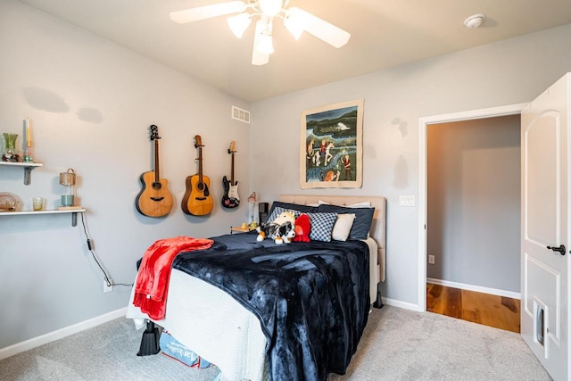 1255 Winterberry Rd, Oconomowoc, WI 53066 - carpeted bedroom with baseboards and ceiling fan