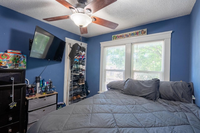 3011 16th St, Racine, WI 53405 - bedroom with a textured ceiling and ceiling fan