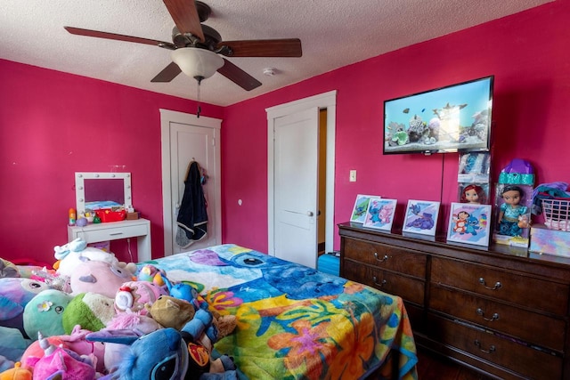 3011 16th St, Racine, WI 53405 - bedroom with a textured ceiling, a ceiling fan, and wood finished floors