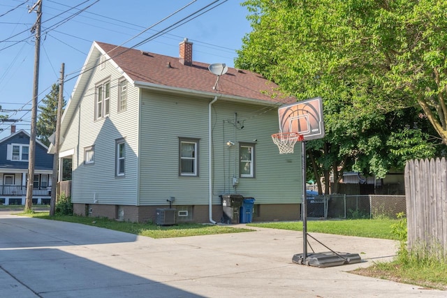 3011 16th St, Racine, WI 53405 - rear view of house featuring a chimney