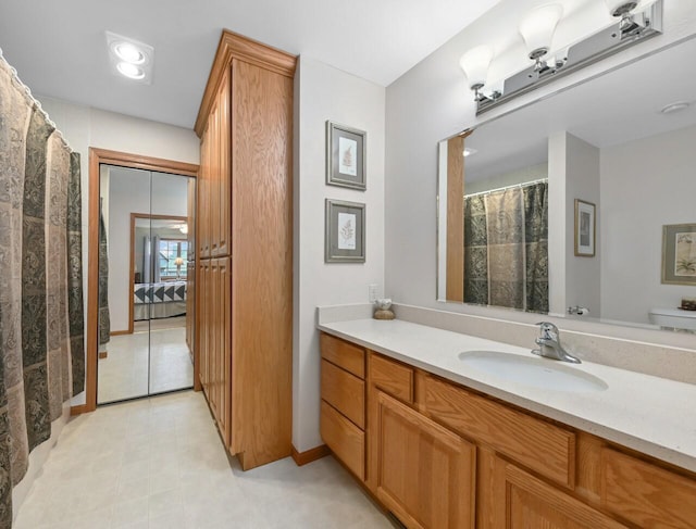 W203N16149 Pin Oak Cir, Jackson, WI 53037 - ensuite bathroom with vanity and tile patterned flooring
