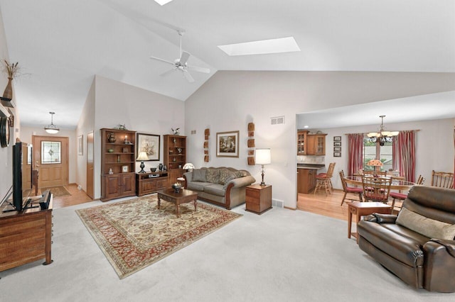 W203N16149 Pin Oak Cir, Jackson, WI 53037 - living area with high vaulted ceiling, light carpet, a chandelier, a skylight, and a ceiling fan