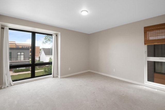 217 N Van Buren St, Green Bay, WI 54301 - empty room with carpet flooring and baseboards