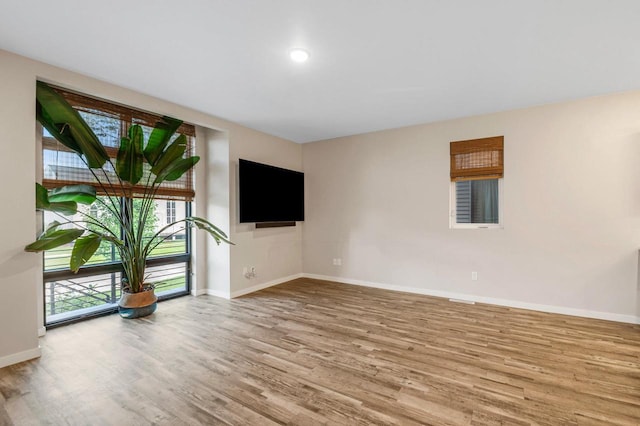 217 N Van Buren St, Green Bay, WI 54301 - unfurnished living room featuring wood finished floors