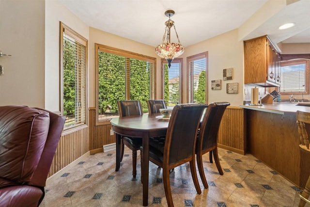 330 W Florida Ave, Appleton, WI 54911 - dining room featuring wainscoting, light tile patterned floors, and wood walls