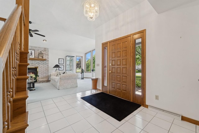 330 W Florida Ave, Appleton, WI 54911 - carpeted foyer with a chandelier, ceiling fan, a brick fireplace, a baseboard radiator, and tile patterned flooring