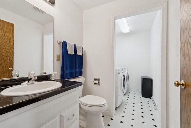 330 W Florida Ave, Appleton, WI 54911 - bathroom featuring washing machine and clothes dryer and vanity