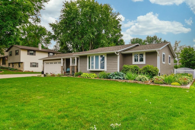 1135 Sharie Ln, Green Bay, WI 54304 - view of front of house featuring a garage and driveway