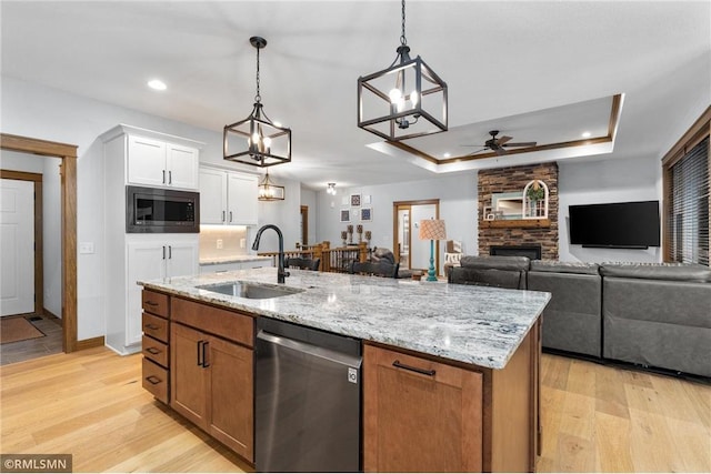 3735 Crest Ridge Ct, Eau Claire, WI 54701 - kitchen with stainless steel appliances, ceiling fan, white cabinetry, a kitchen island with sink, and light wood-type flooring