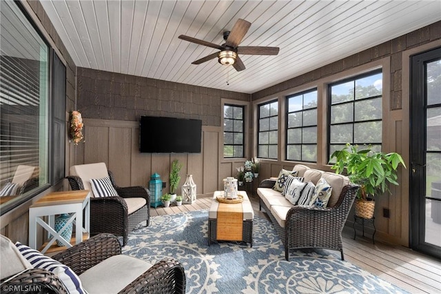 3735 Crest Ridge Ct, Eau Claire, WI 54701 - sunroom / solarium with an outdoor living space, hardwood / wood-style floors, a ceiling fan, a wooden deck, and wooden ceiling