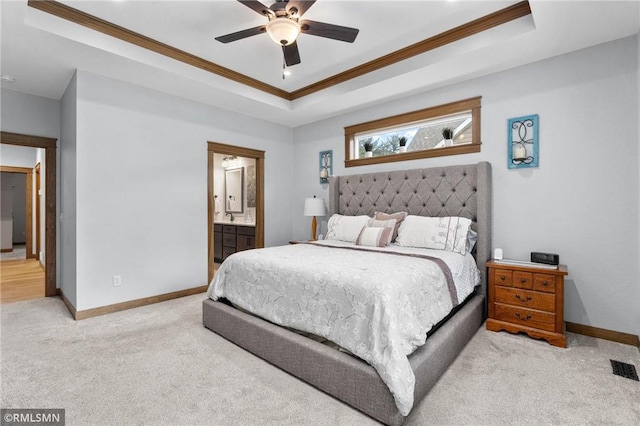 3735 Crest Ridge Ct, Eau Claire, WI 54701 - bedroom with a tray ceiling, crown molding, carpet flooring, connected bathroom, and ceiling fan