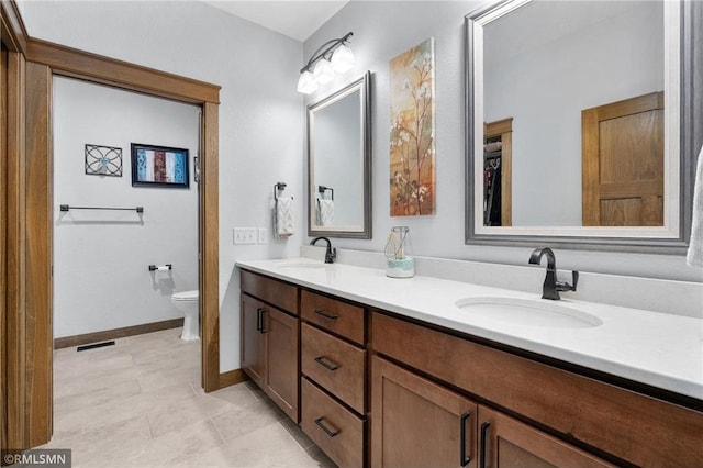 3735 Crest Ridge Ct, Eau Claire, WI 54701 - bathroom featuring double vanity and toilet