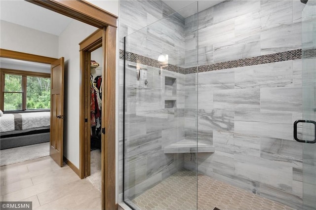 3735 Crest Ridge Ct, Eau Claire, WI 54701 - full bath featuring a stall shower, connected bathroom, a spacious closet, and tile patterned floors