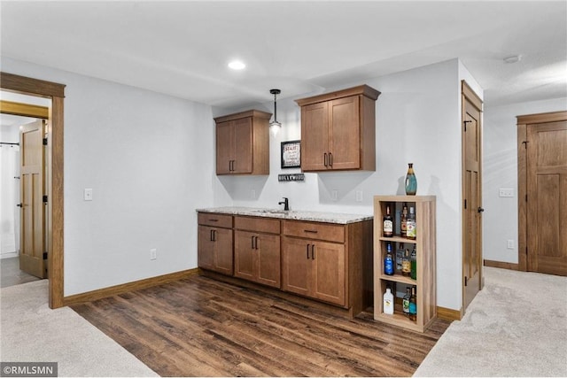 3735 Crest Ridge Ct, Eau Claire, WI 54701 - bar area with hanging light fixtures and dark wood finished floors