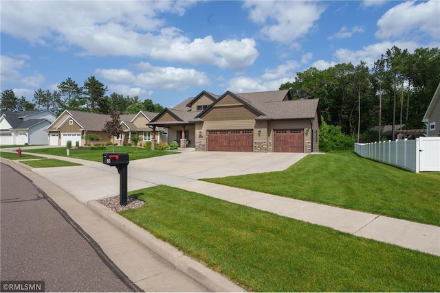 3735 Crest Ridge Ct, Eau Claire, WI 54701 - craftsman house featuring stone siding, a garage, and driveway