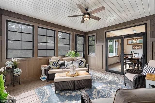3735 Crest Ridge Ct, Eau Claire, WI 54701 - sunroom featuring hardwood / wood-style flooring, a wooden deck, a decorative wall, and wood walls