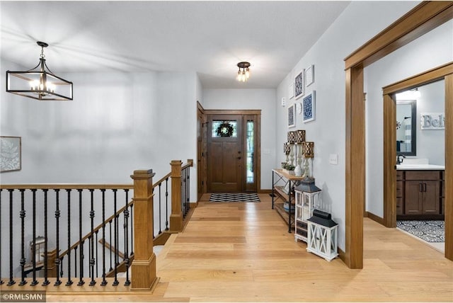 3735 Crest Ridge Ct, Eau Claire, WI 54701 - entrance foyer with light wood-style floors and a chandelier