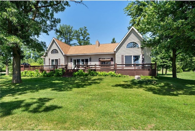 2282 71st St, Luck, WI 54853 - back of house with a wooden deck, a chimney, and a yard