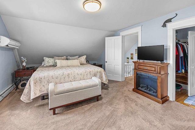 1515 Rugby St, Oshkosh, WI 54902 - carpeted bedroom featuring lofted ceiling, a wall mounted AC, and a spacious closet